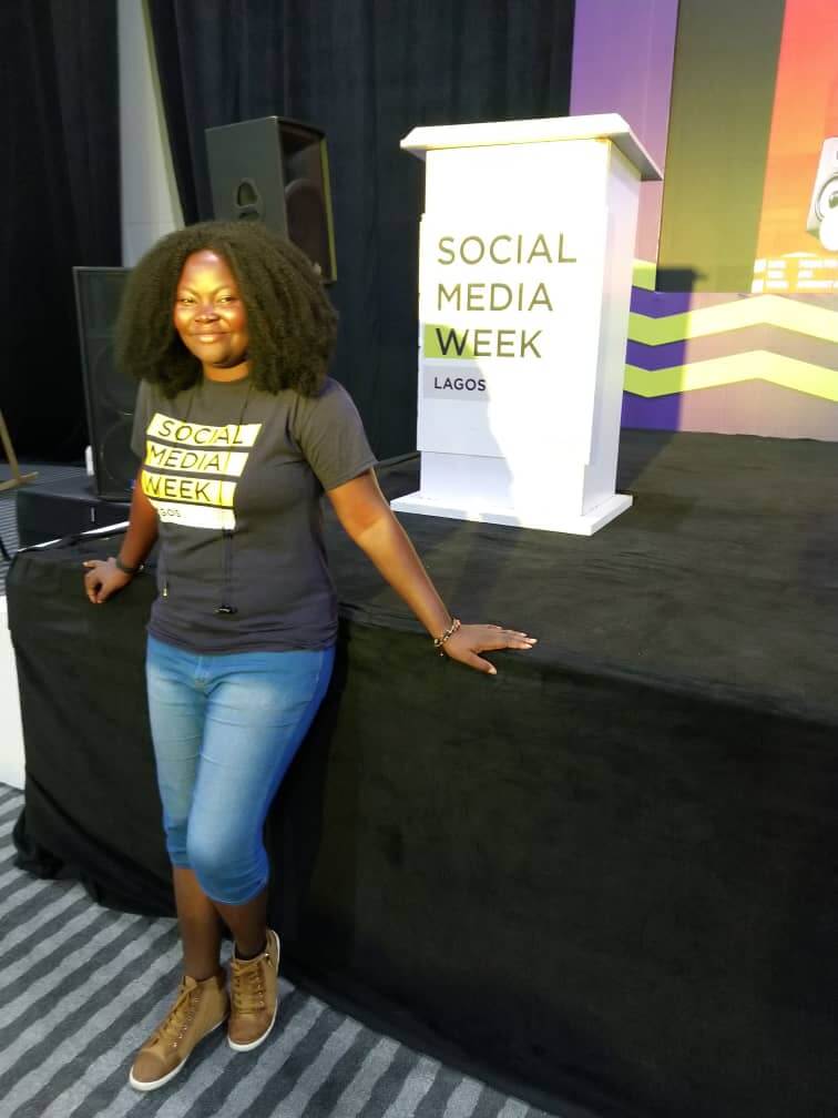 Mary Job posing for a camera at SMWLagos19 Stage