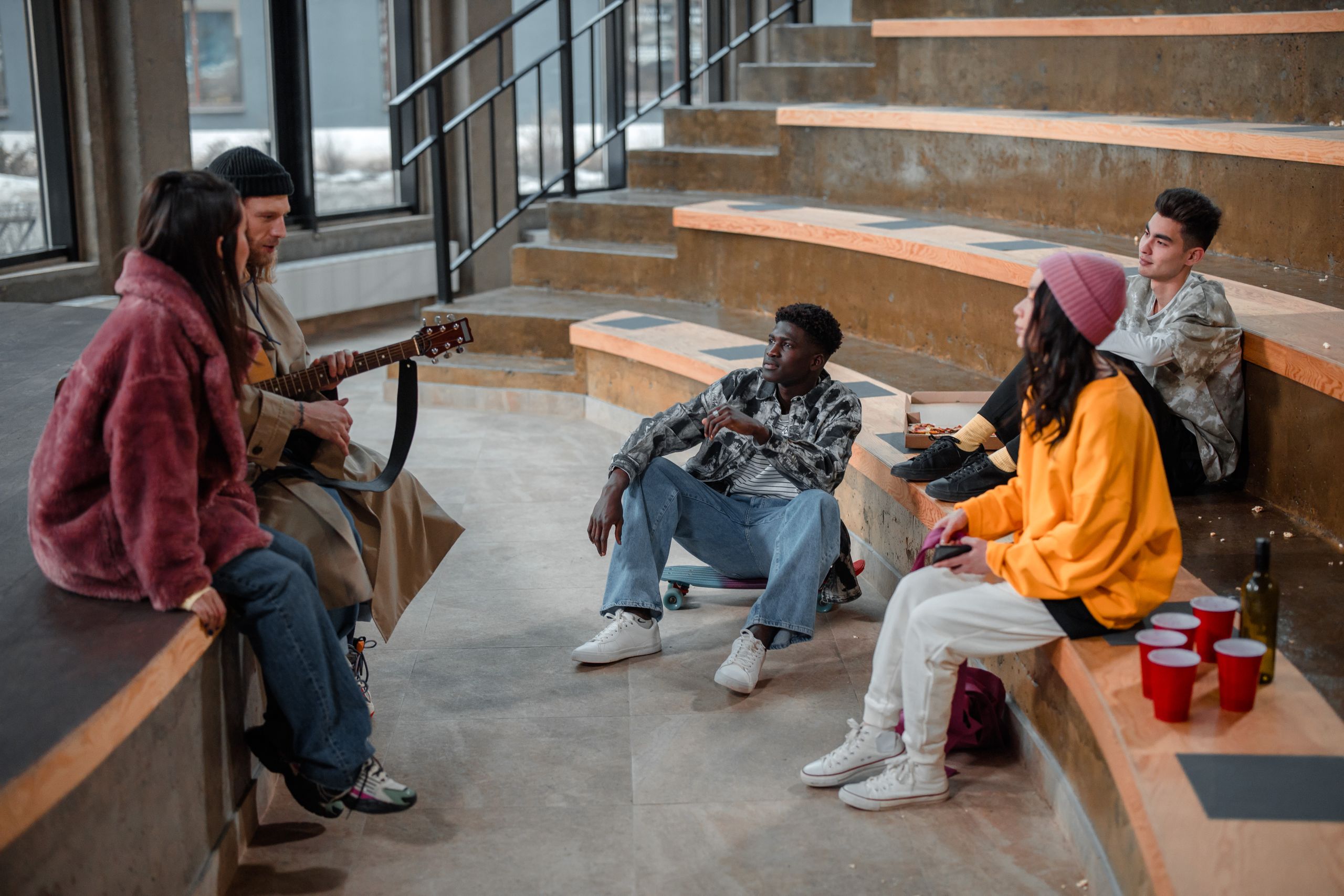 People sharing an open conversation in a welcoming community where different perspectives are respected.